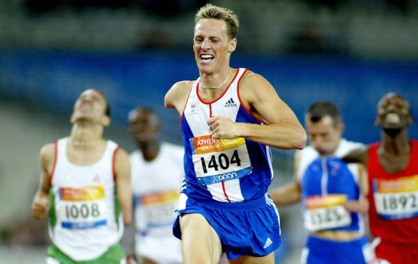 Paralympian Danny Crates running in a professional race in the GB team kit