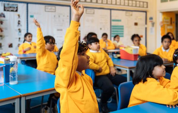 A child raising their hand during a National Numeracy event