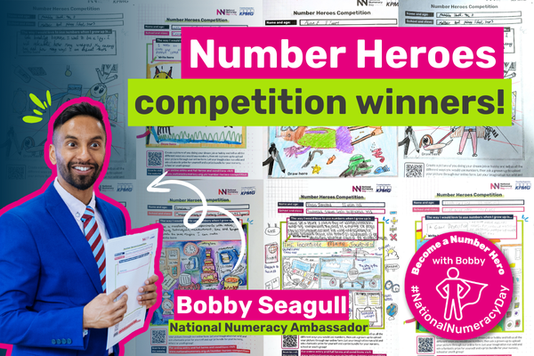 Photo of Bobby Seagull in front of the winning competition entries, with text saying "Number Heroes competition winners!"
