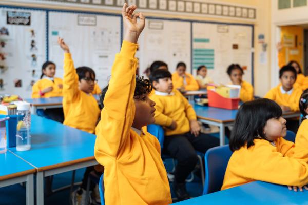 A child raising their hand during a National Numeracy event