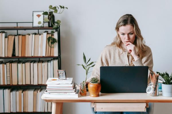 Person sitting at a desk with a computer